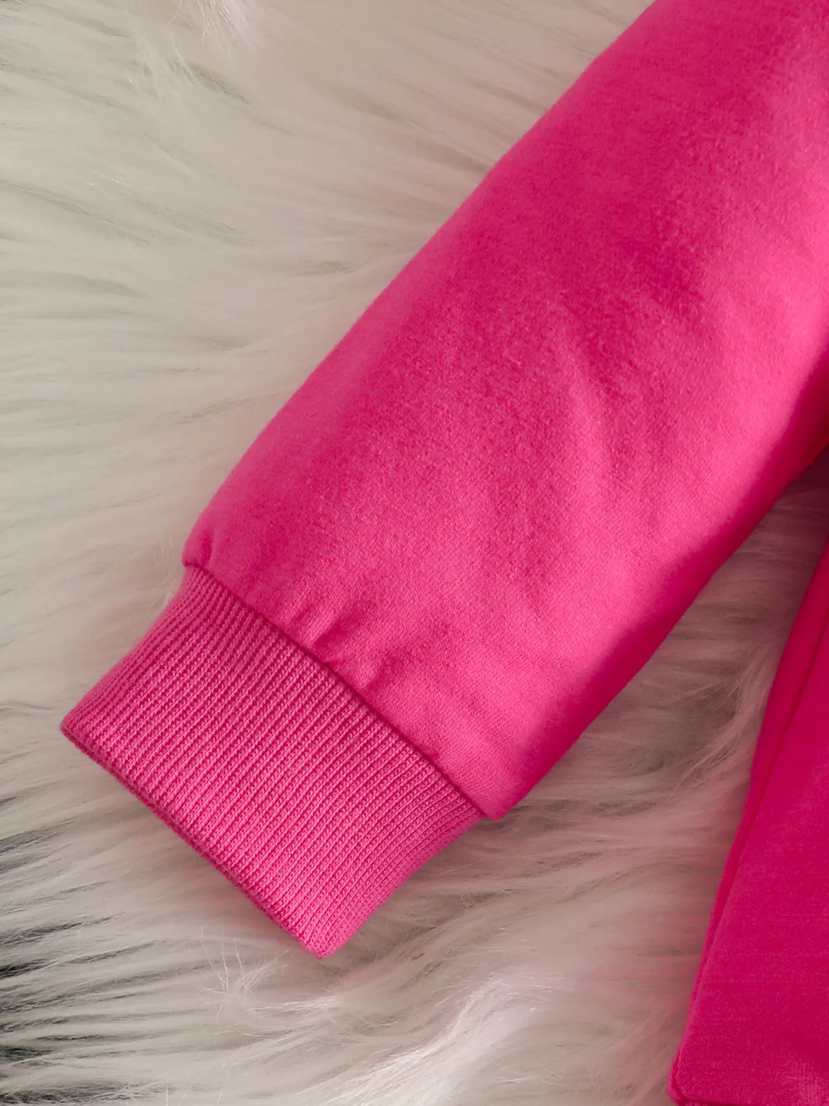 Bow embellished sweatshirt and black pants set — fuchsia ribbed sleeve cuff