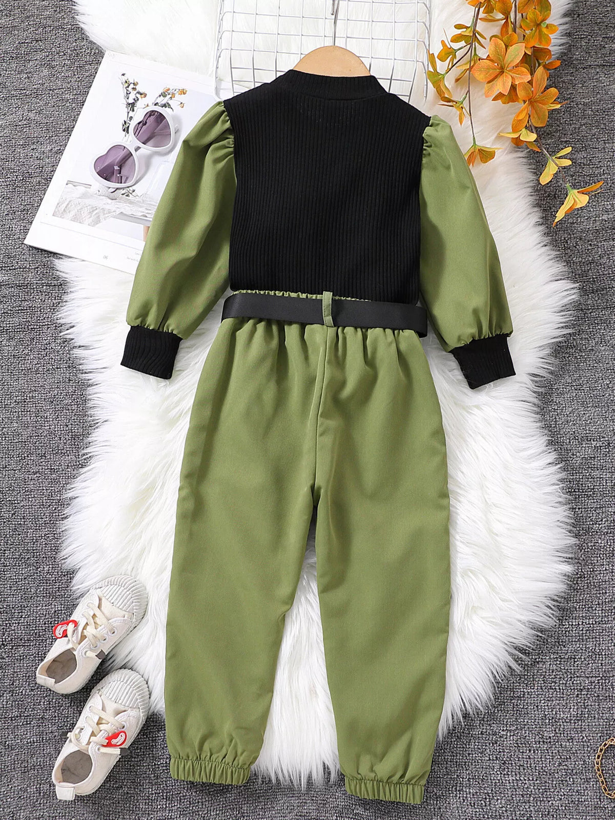 Back of the black-and-green top and pants