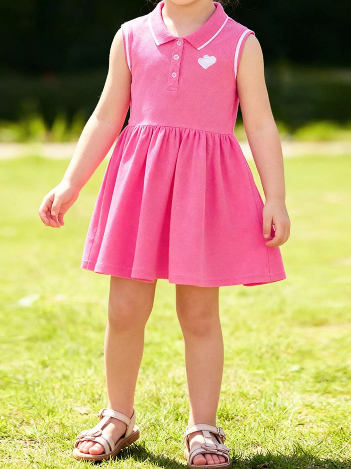 Pink Heart Sleeveless Polo Dress — dress worn by a child