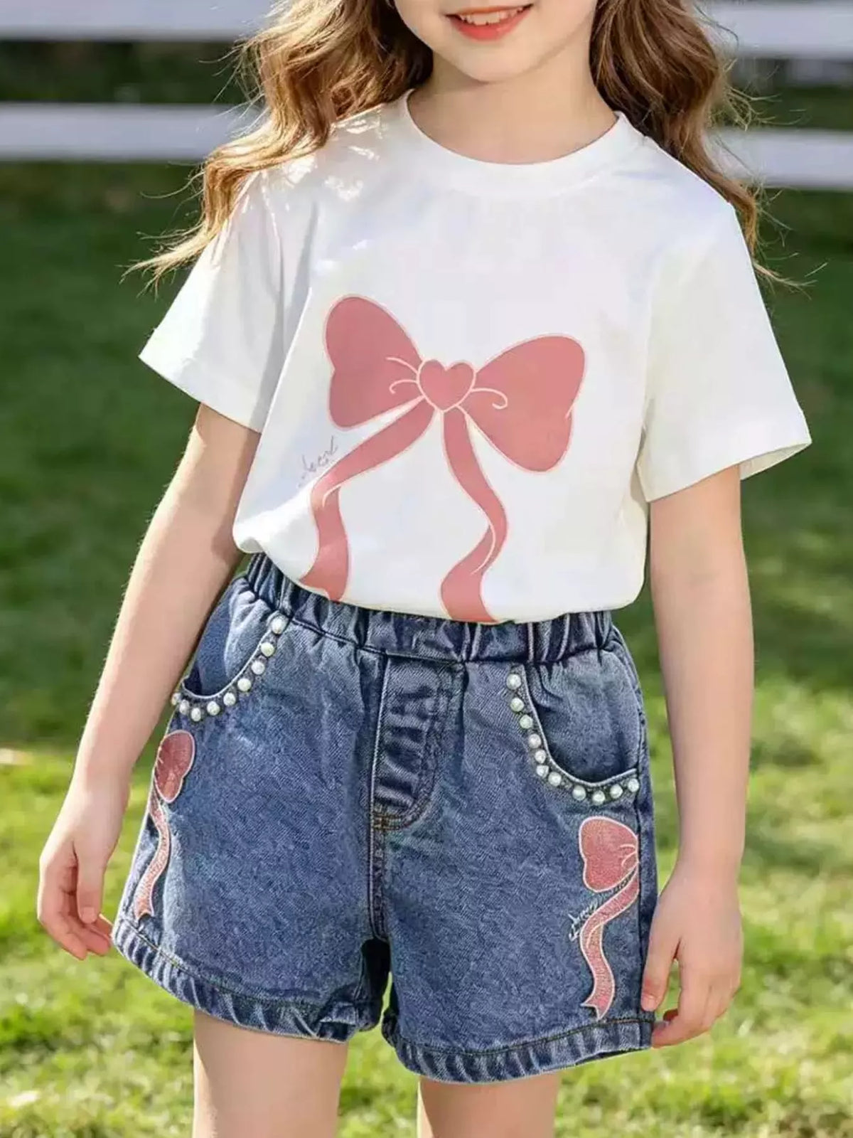 Bow graphic tee and bow embellished denim shorts set — white tee and denim shorts shown on child