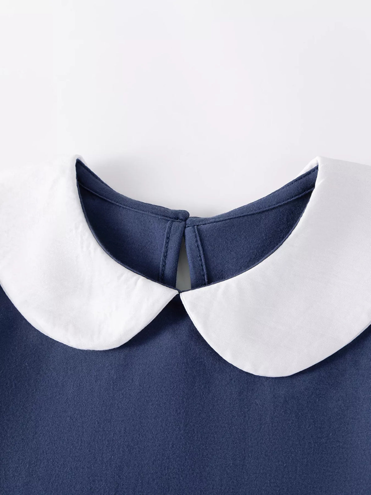 White rounded collar and back keyhole