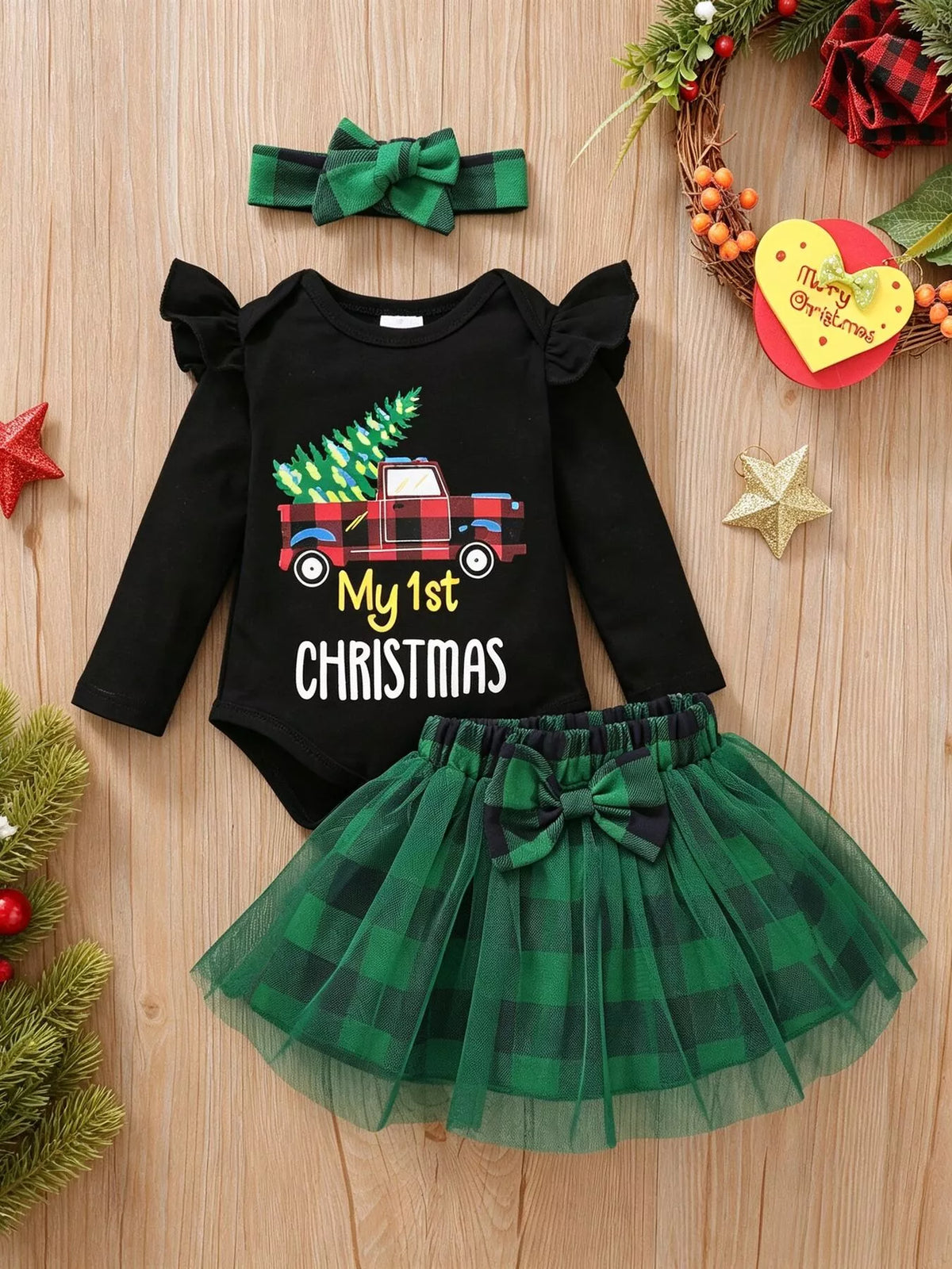 Black My 1st Christmas top and green plaid tulle skirt with headband — full outfit laid flat
