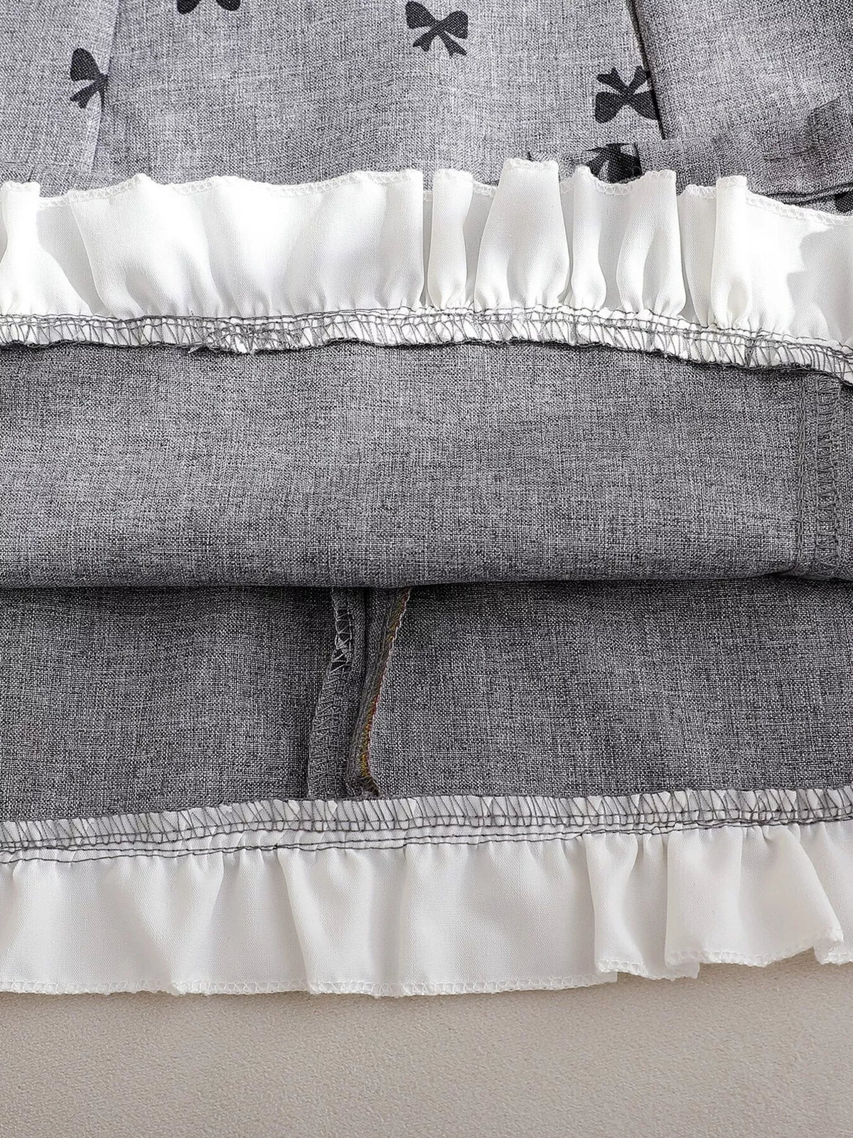 White ruffled hem and inside stitching