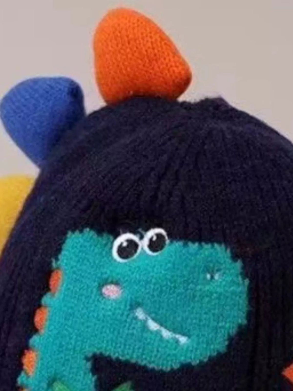 Dinosaur Knit Hat with Earflaps — navy hat crown and spikes detail