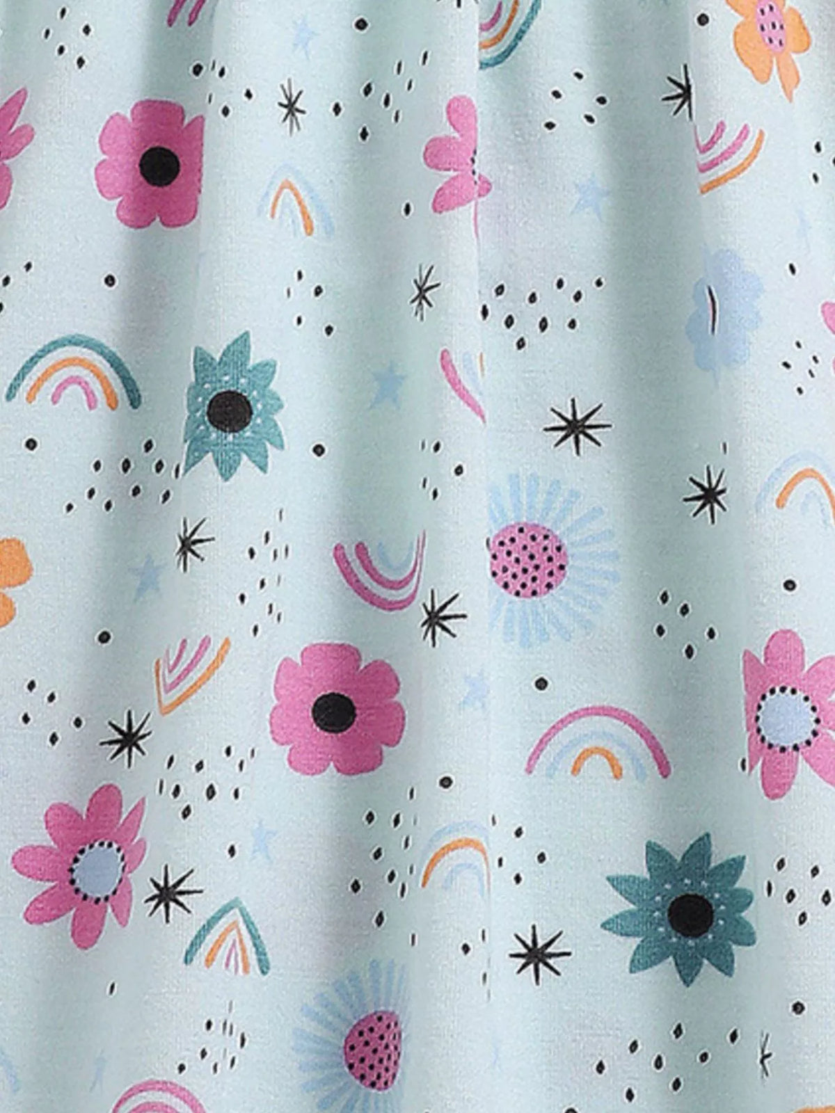 Flowers, rainbows and small stars on pale blue fabric