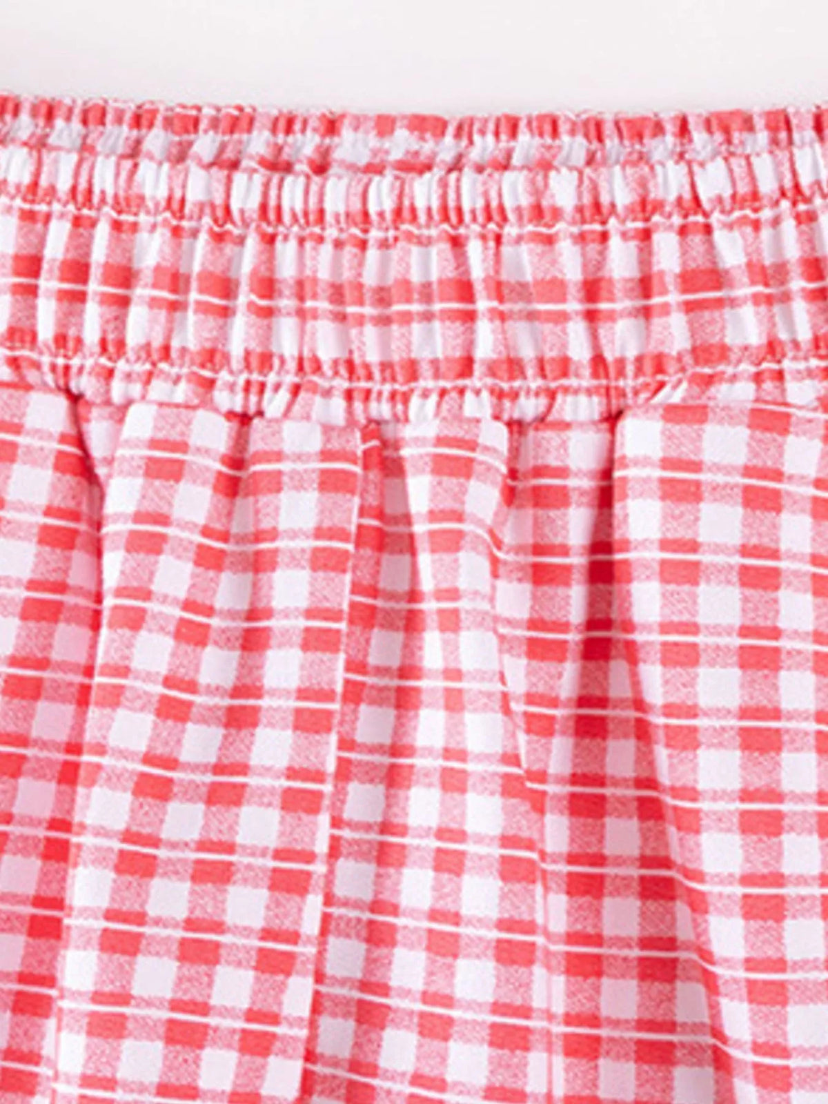 Elastic waistband on red gingham pants