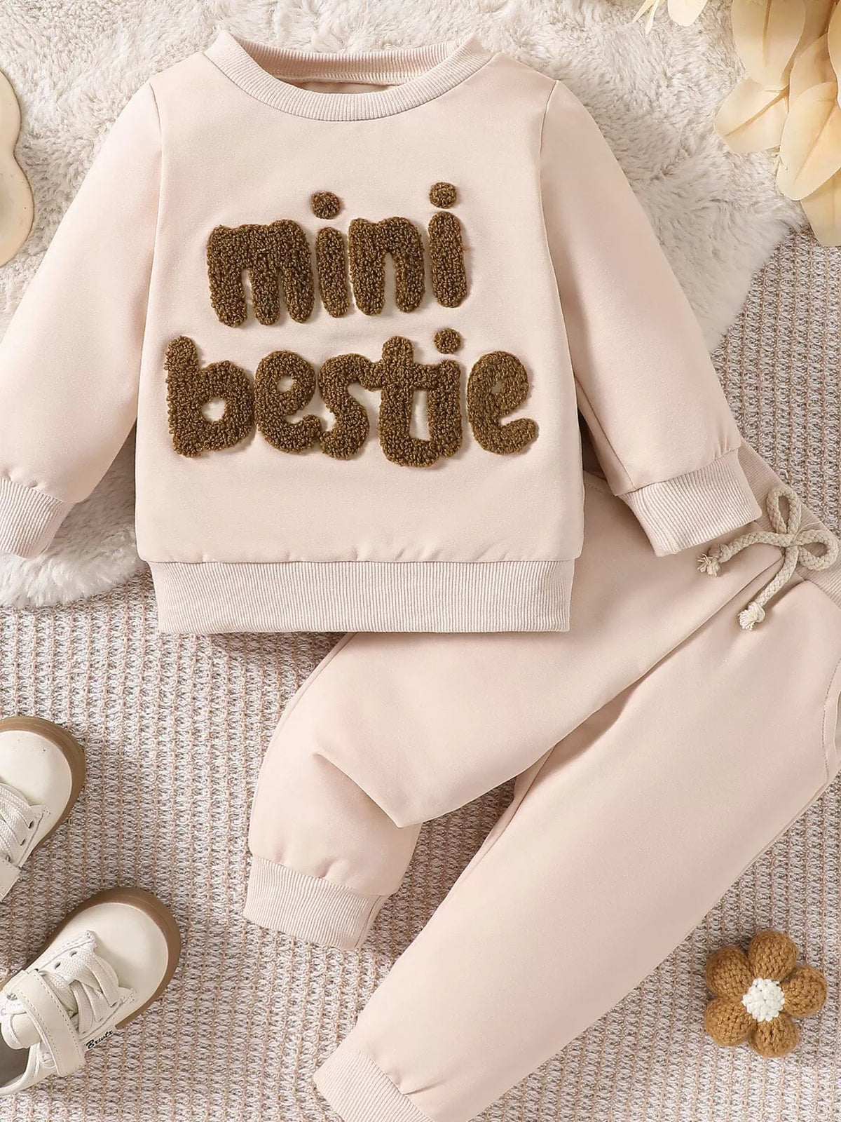 Cream Mini Bestie sweatshirt with matching cuffed pants laid flat