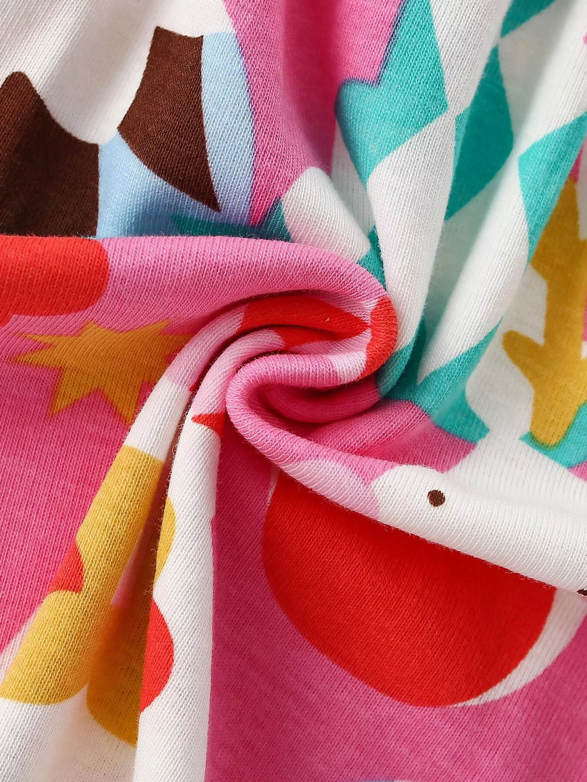 Multicolored Christmas-print fabric close-up