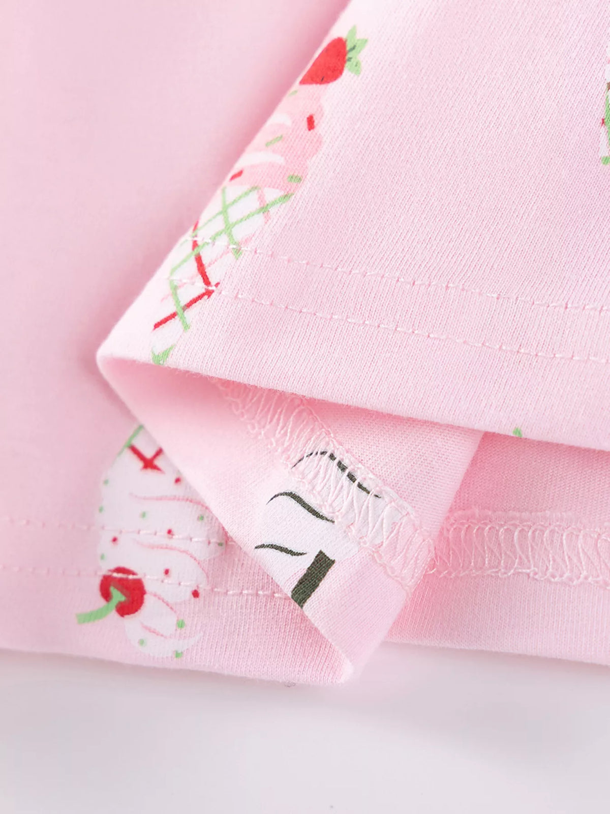 Inside stitching at the pink printed hem