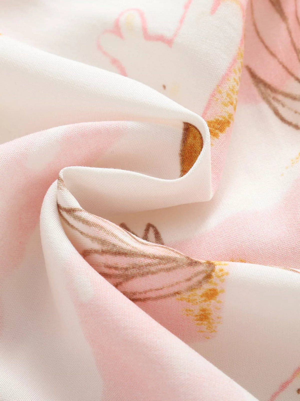 Pink and brown botanical-print fabric close-up