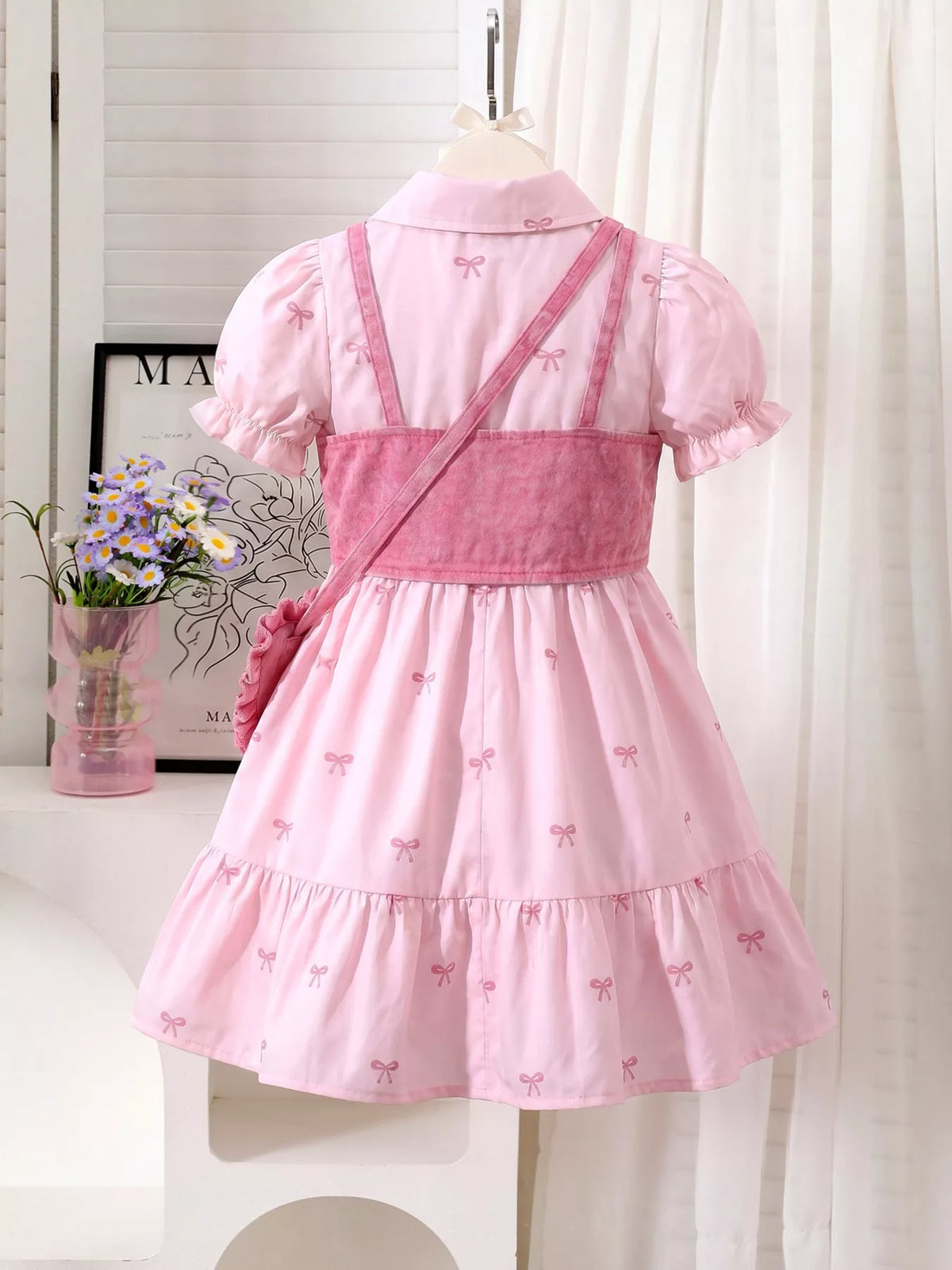 Back of the pink dress and cropped vest