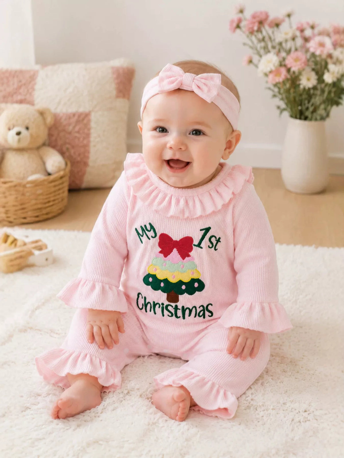 Jumpsuit and headband on a seated baby