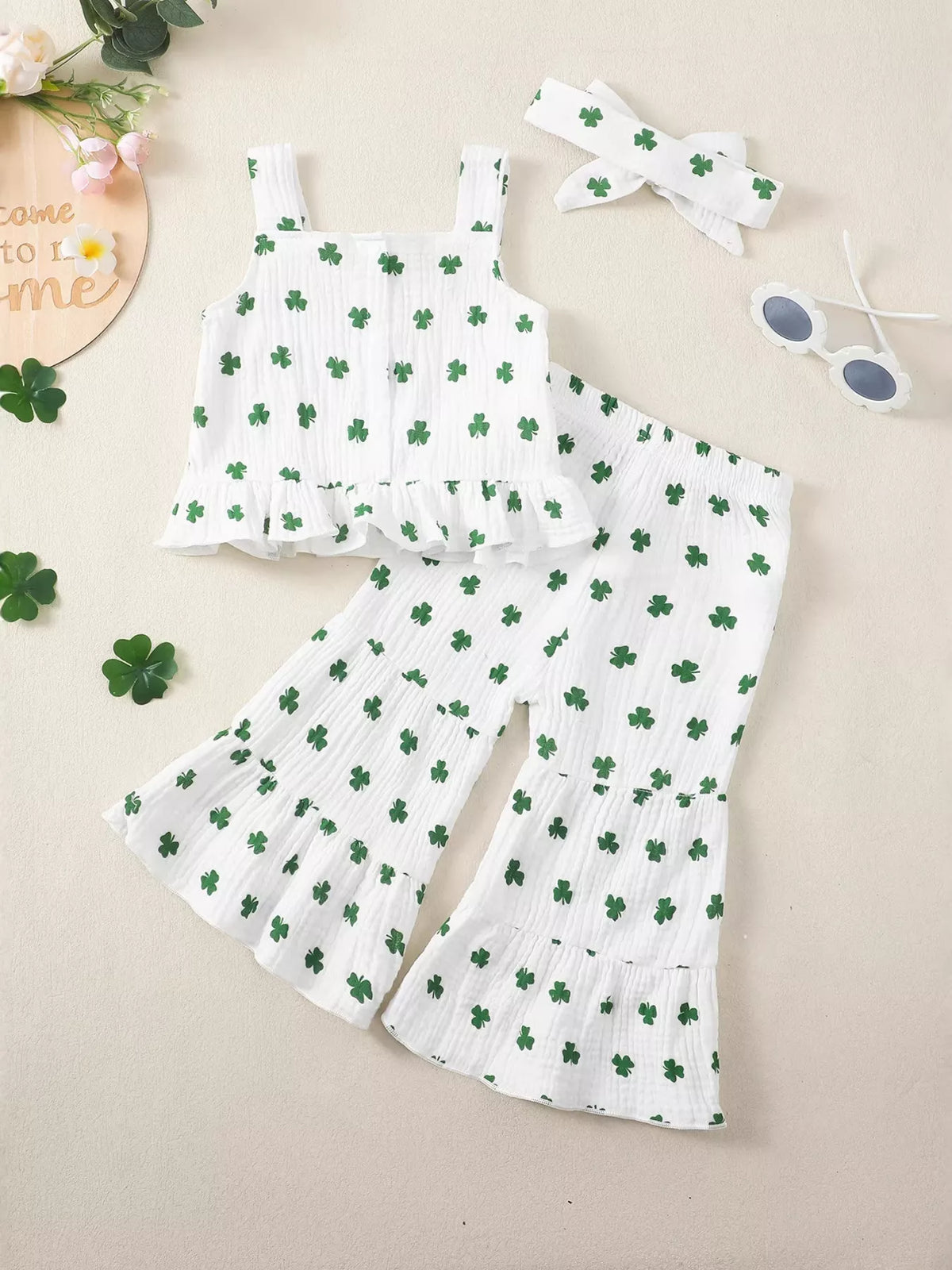 White shamrock ruffle top and flared pants with headband — outfit back