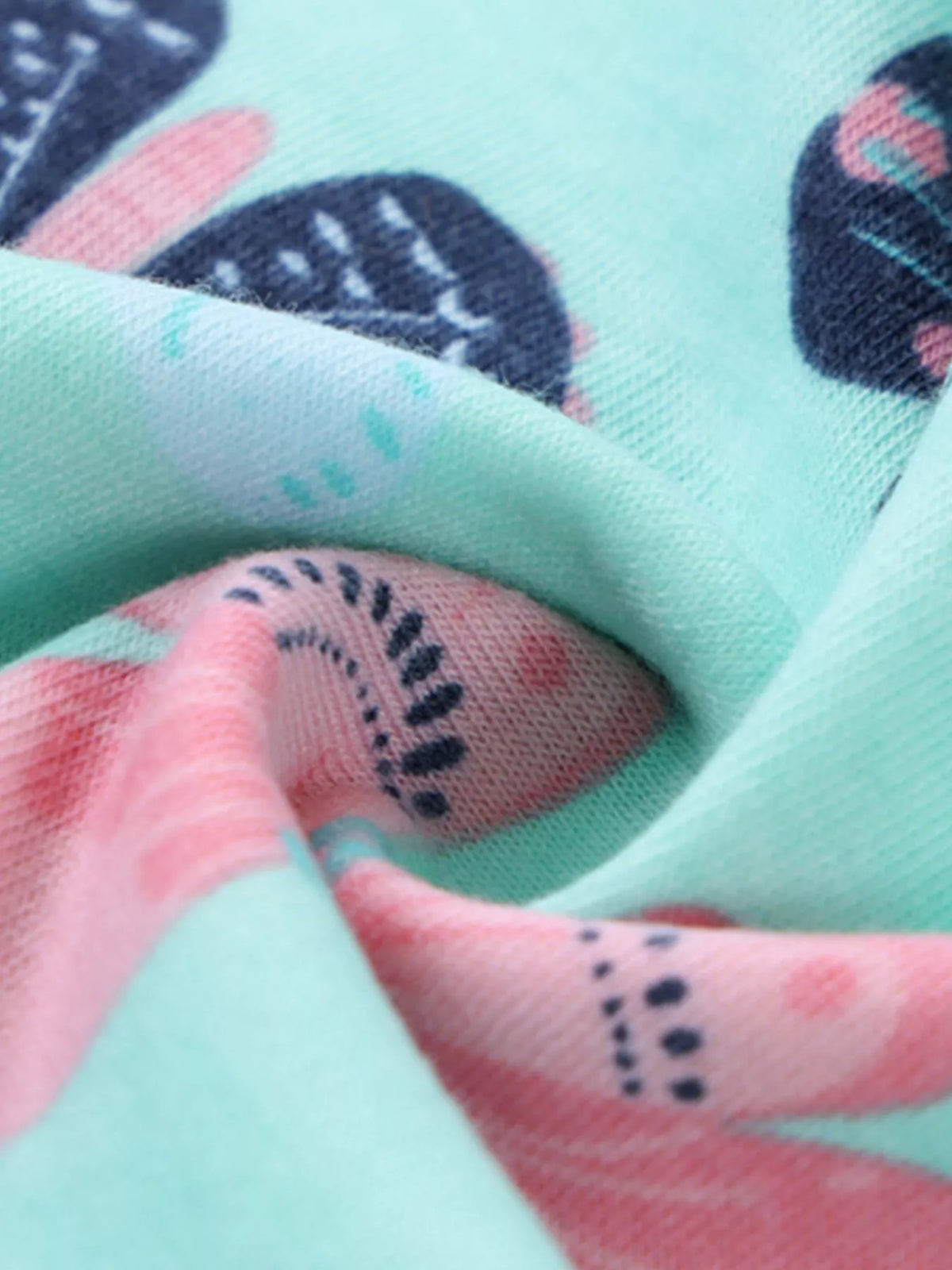 Aqua butterfly-print fabric close-up