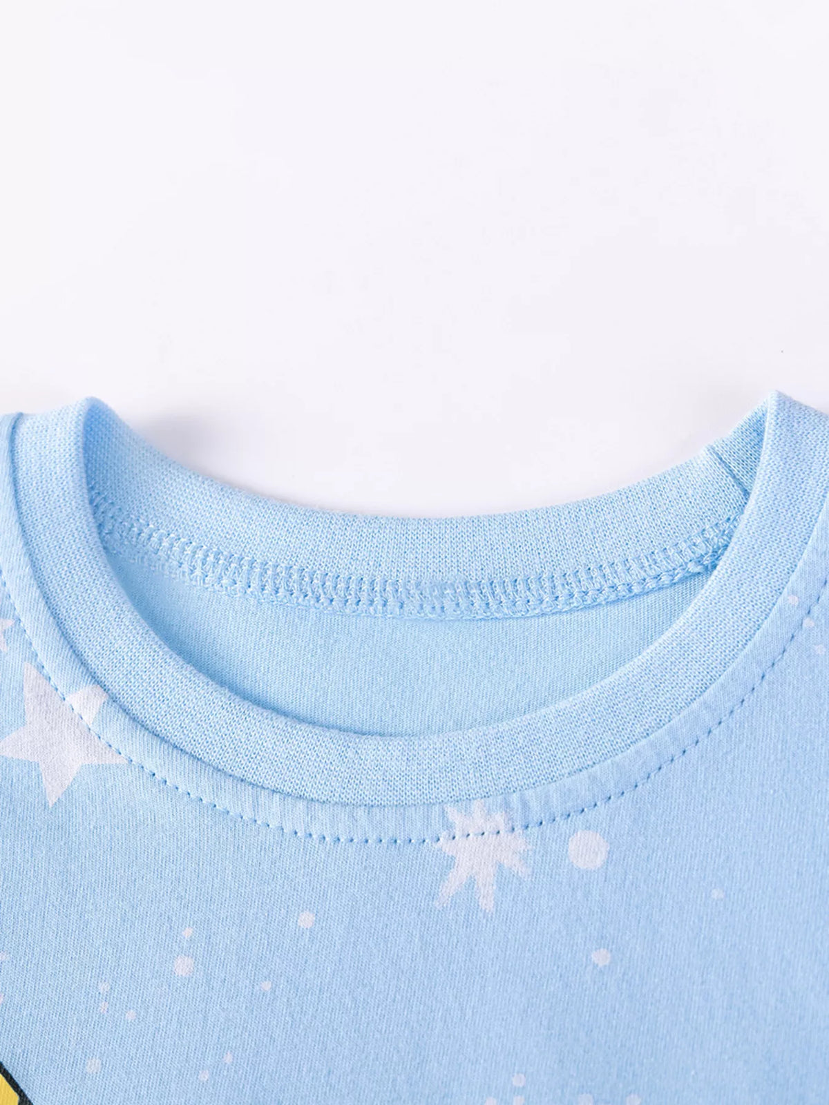 Blue ribbed neckline and white star motifs