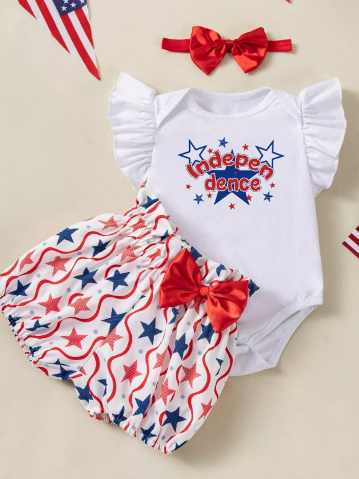 Baby Fourth of July Three-Piece Outfit Set — Independence Day bodysuit shorts and headband flat lay