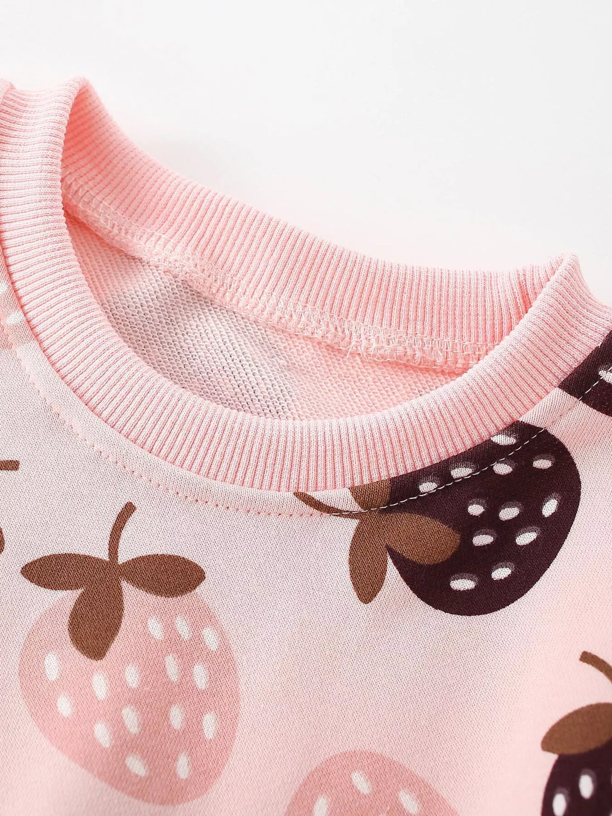 Pink ribbed neckline and strawberry motifs