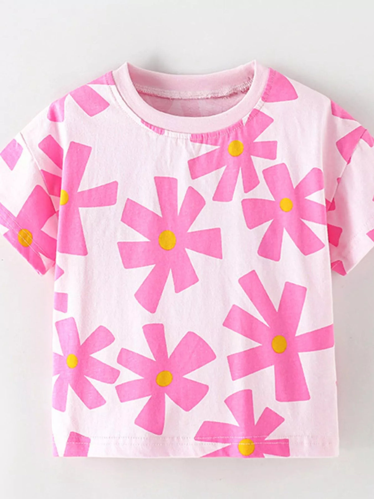 Pink bold flower print shirt — front laid flat