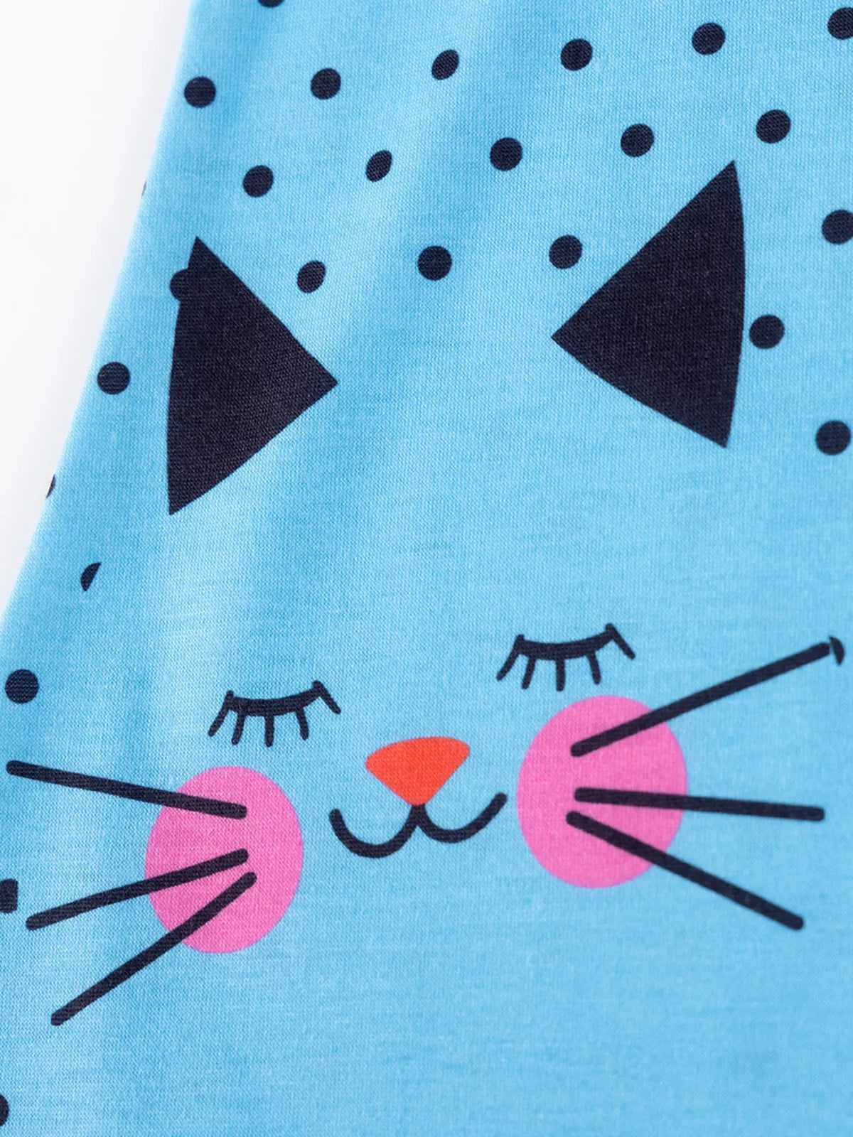 Cat face with pink cheeks on blue fabric