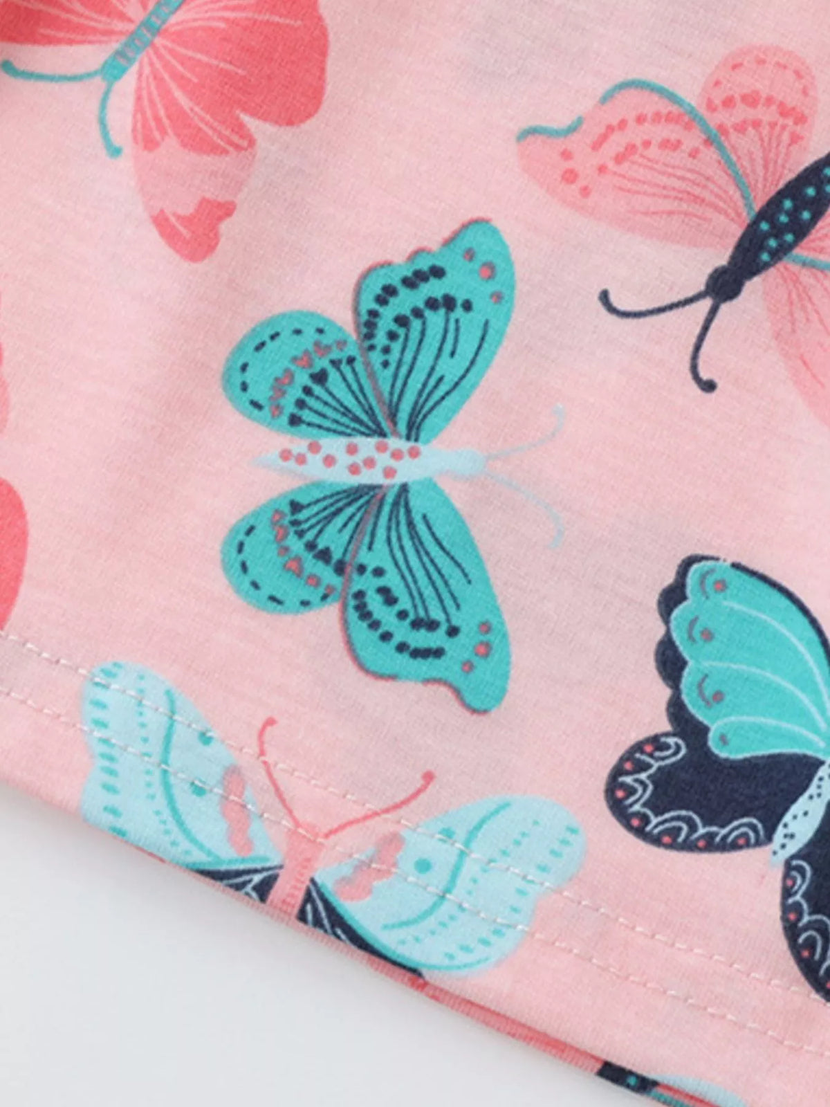 Butterfly print at the pink skirt hem