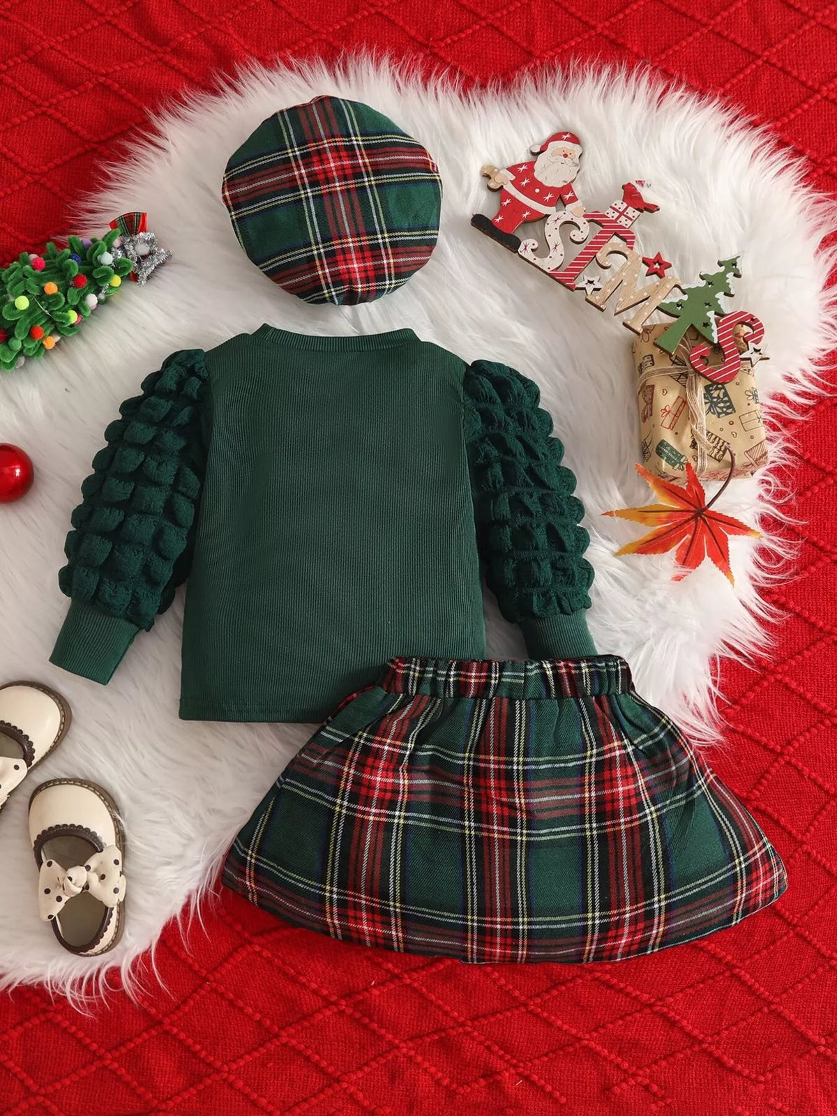 Back of the green top with plaid skirt and hat