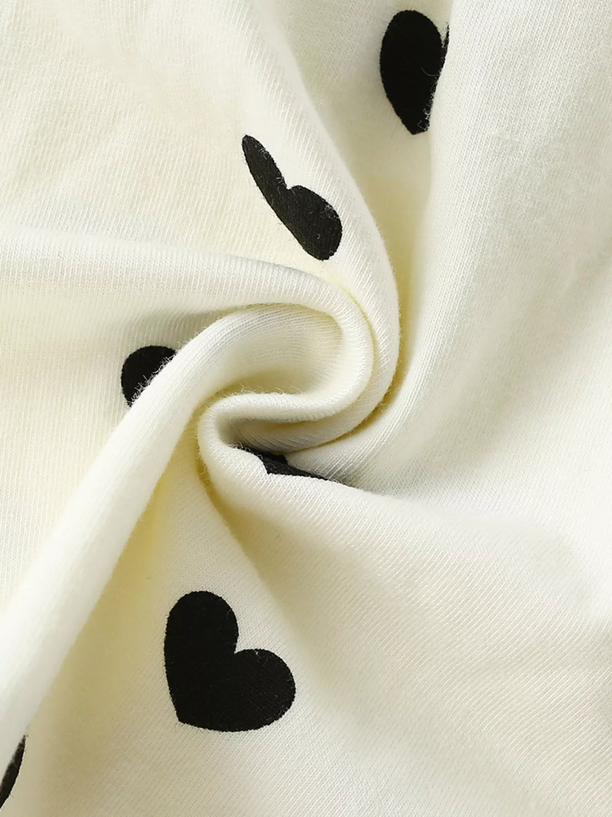 Black-heart print on ivory fabric