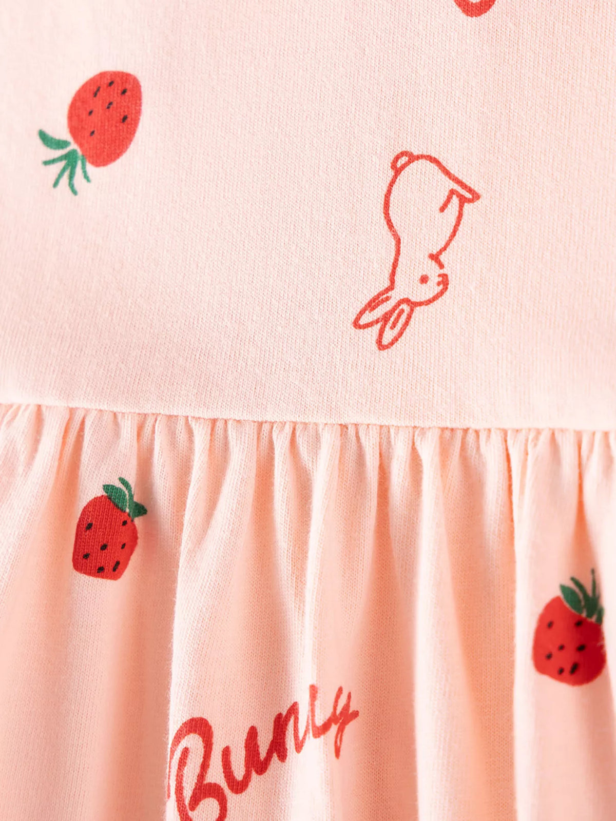 Bunny outline and strawberry motifs at the gathered waist
