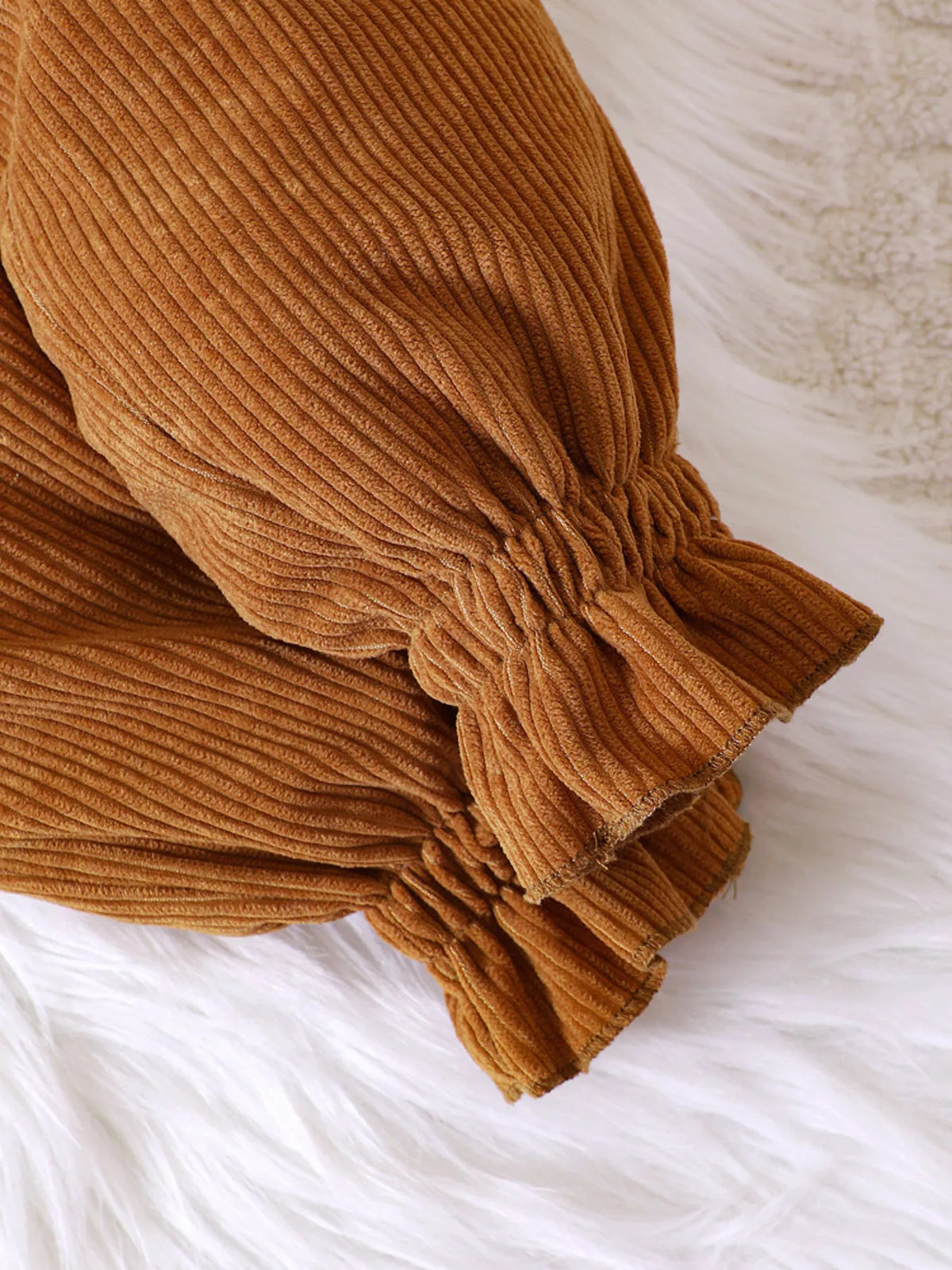 Gathered ruffled cuffs on caramel corduroy pants