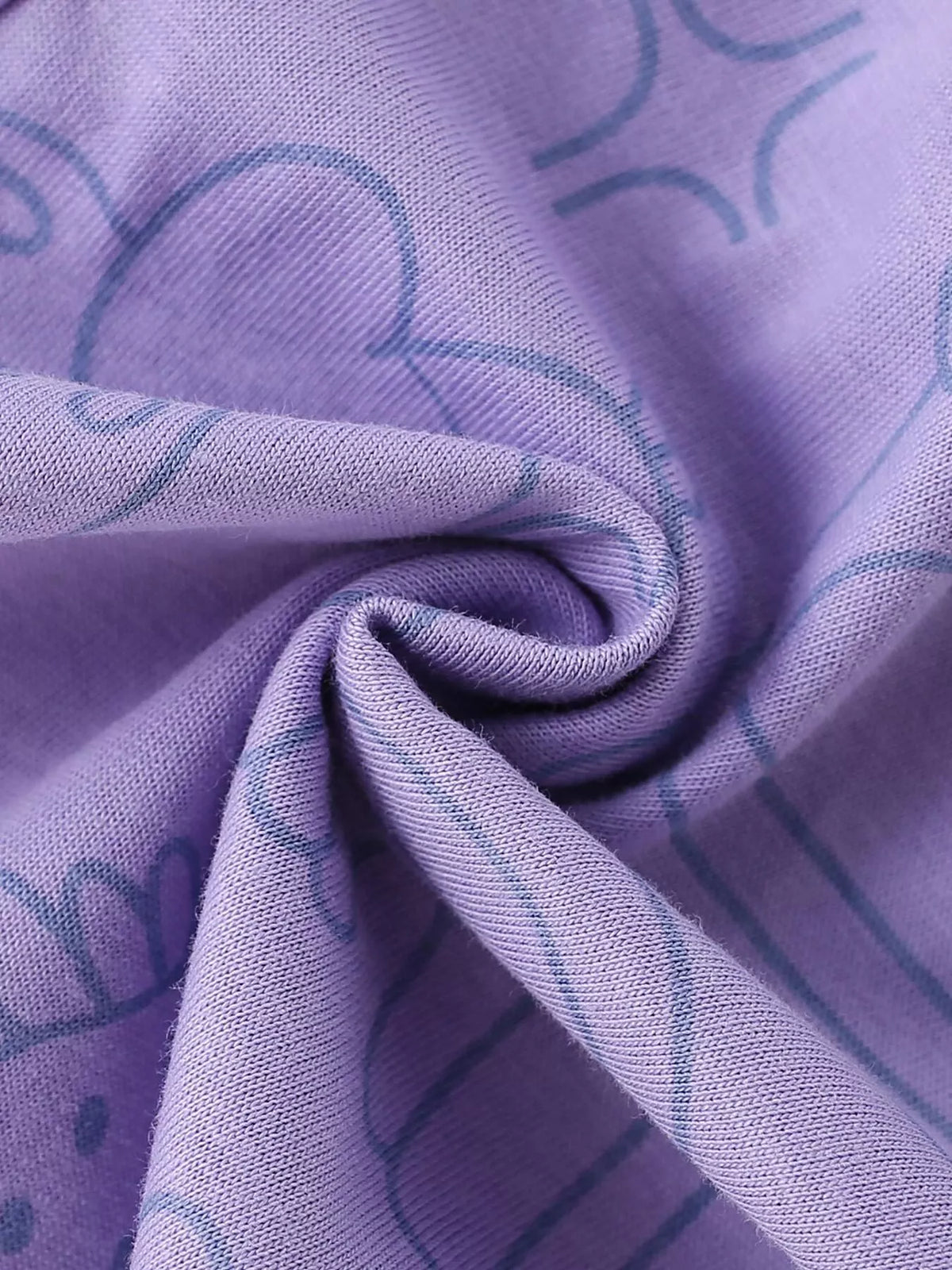 Purple patterned pant fabric close-up