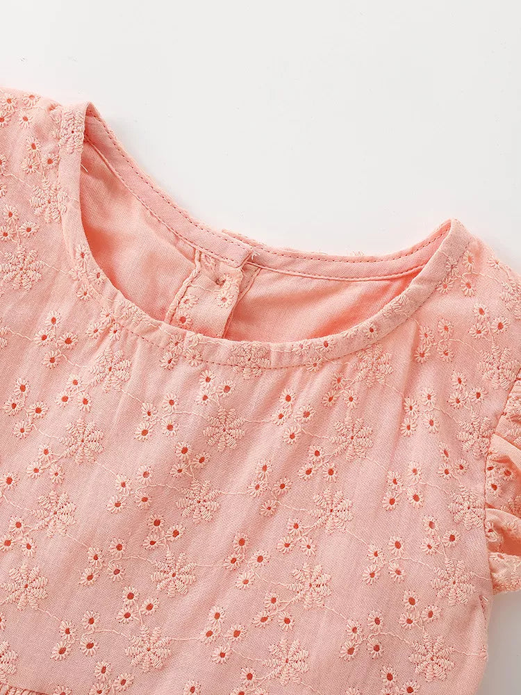 Round neckline and peach eyelet bodice