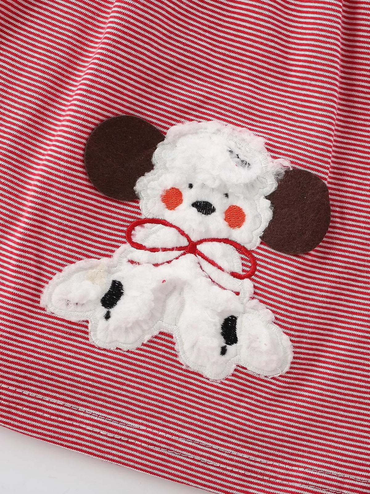 Textured white puppy applique on red stripes