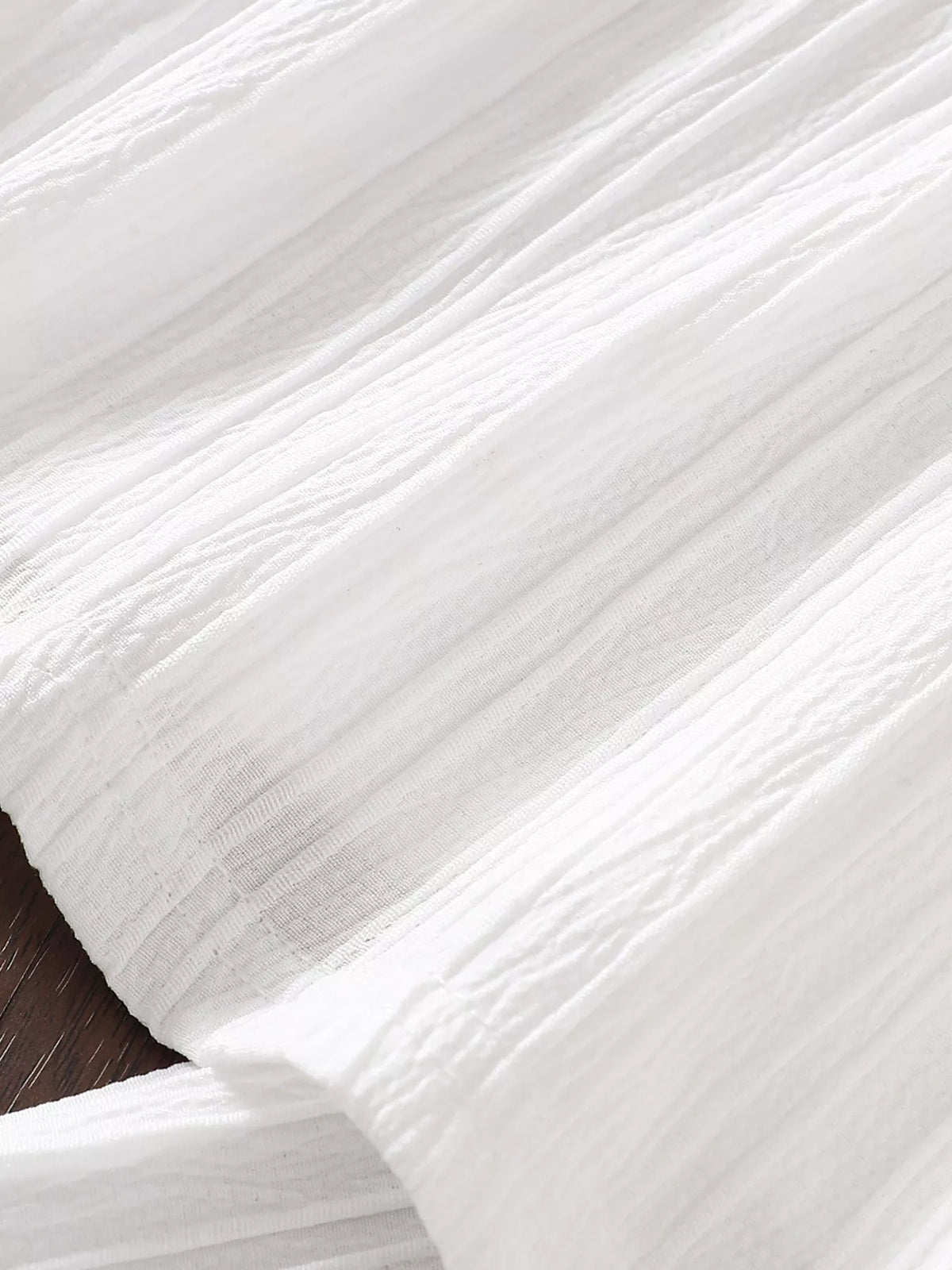 White textured pant fabric close-up