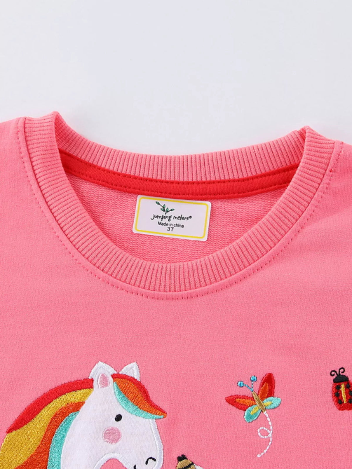 Pink floral unicorn applique sweatshirt — ribbed round neckline