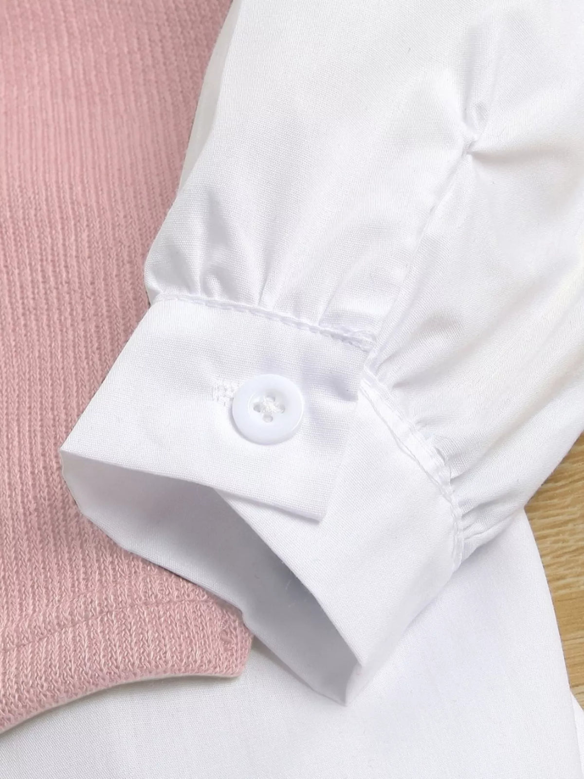 White buttoned sleeve cuff