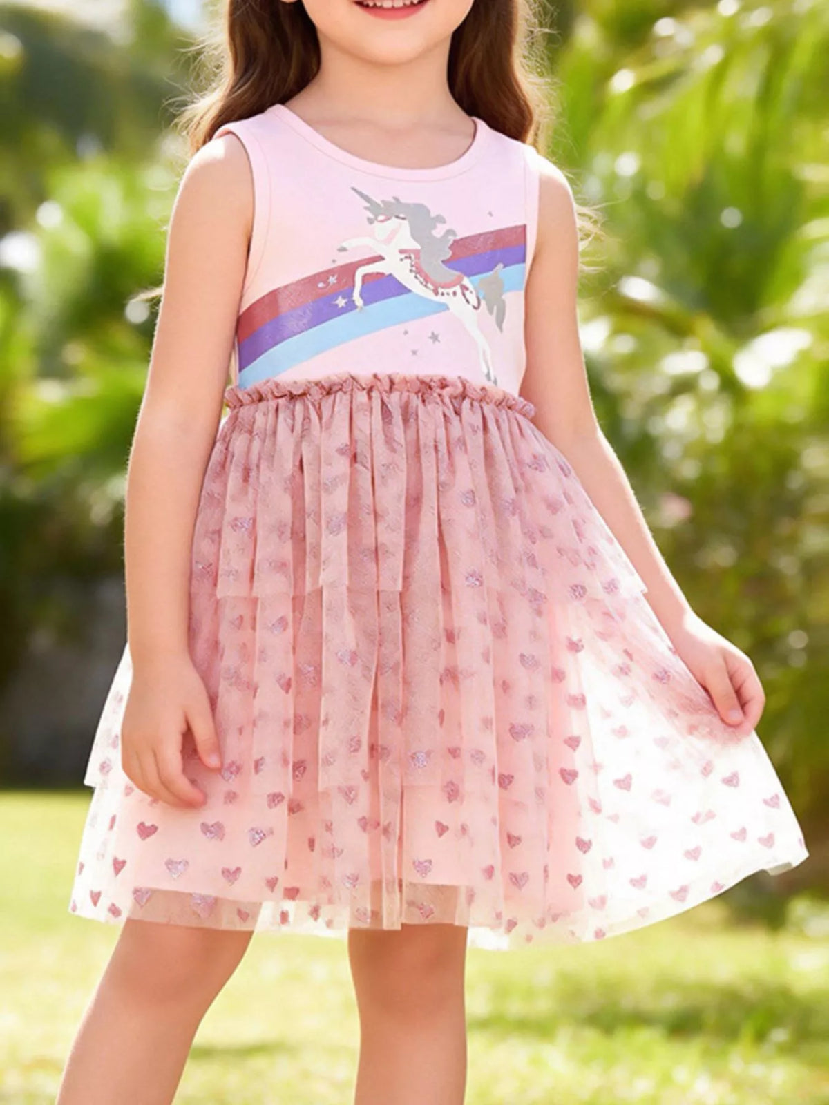 Pink sleeveless unicorn-and-rainbow dress with a heart tulle skirt on a child