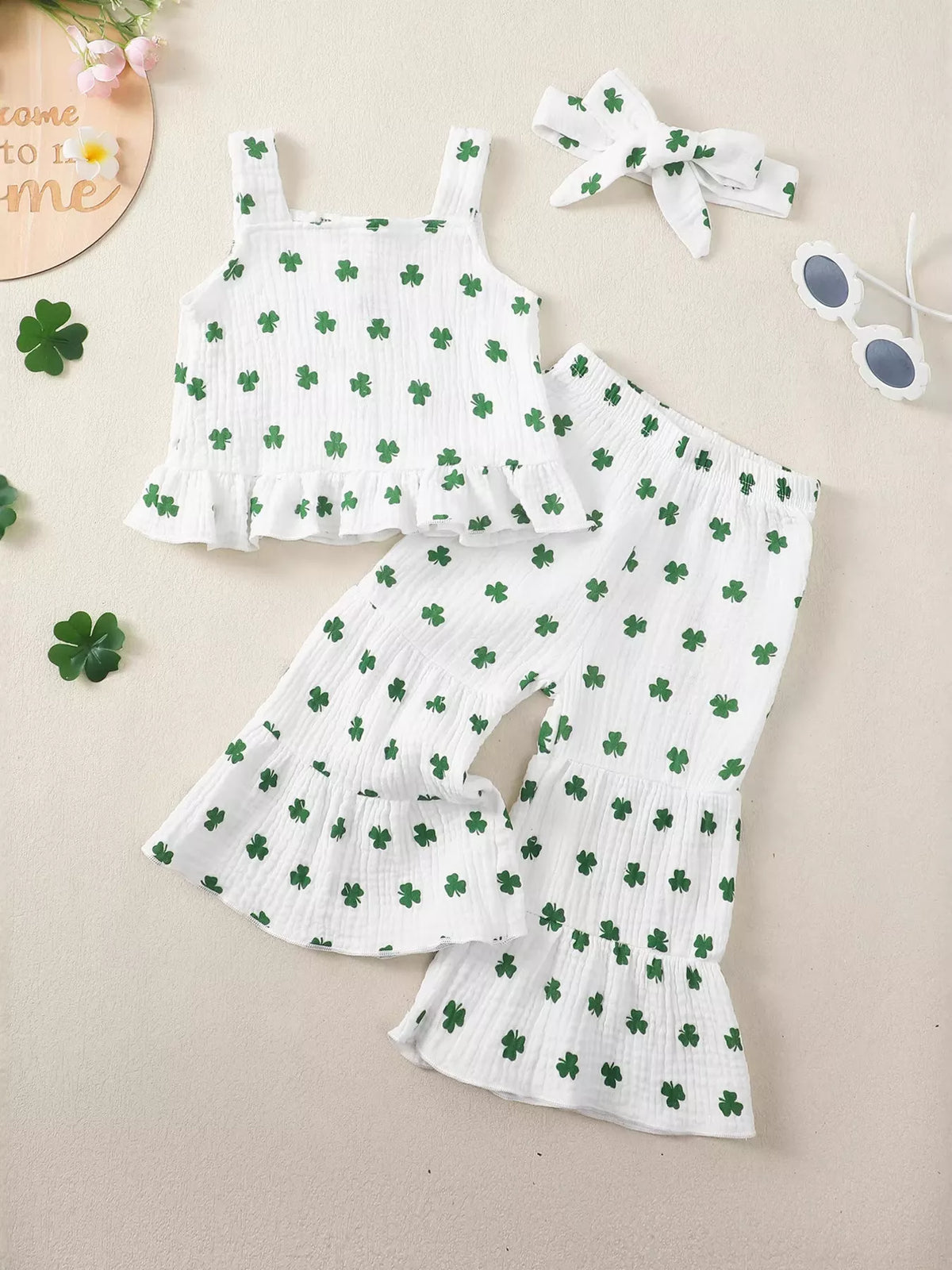White shamrock ruffle top and flared pants with headband — full outfit front