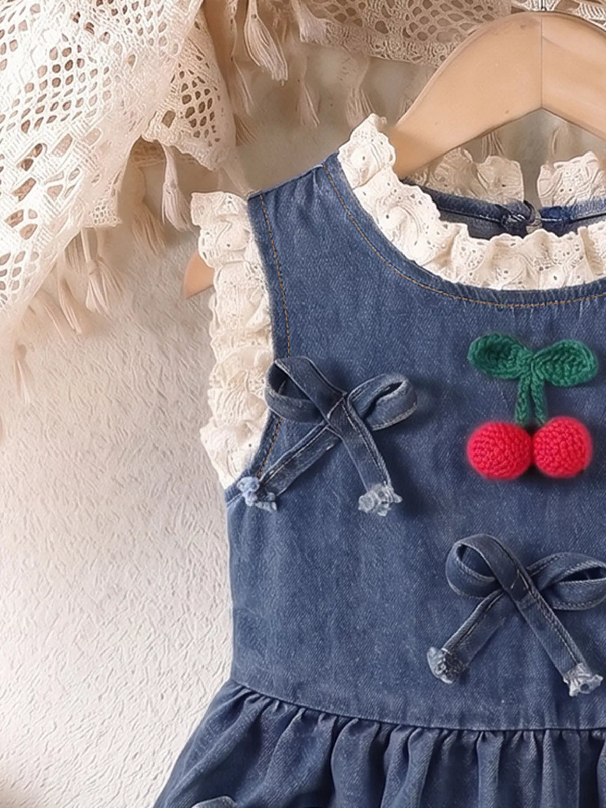Lace-trimmed neckline with raised cherry appliques