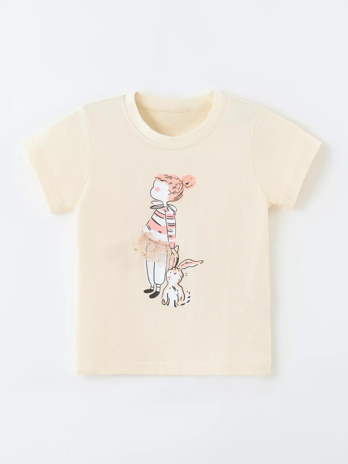 Cream tee with a girl-and-bunny graphic laid flat