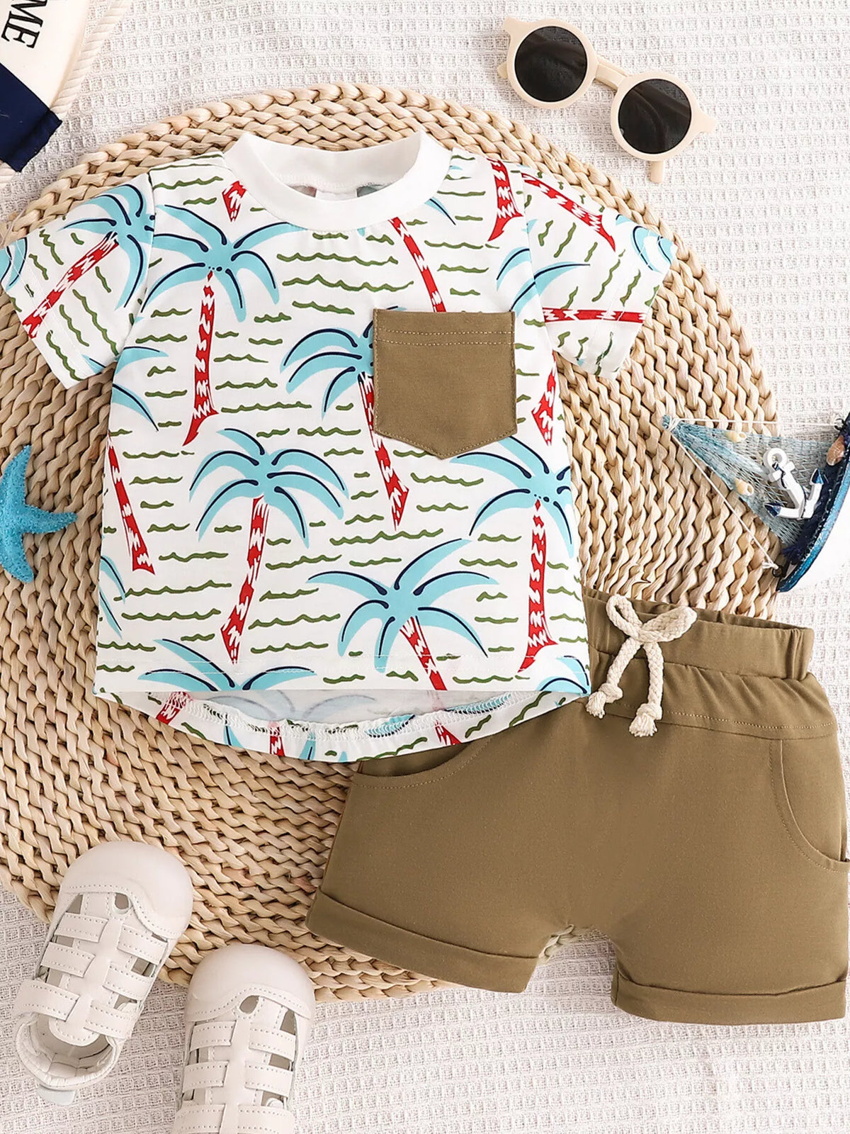 Palm-tree tee with brown pocket and brown shorts laid flat