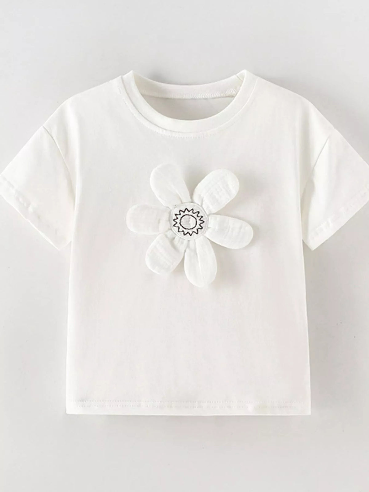 White dimensional flower applique shirt — front laid flat