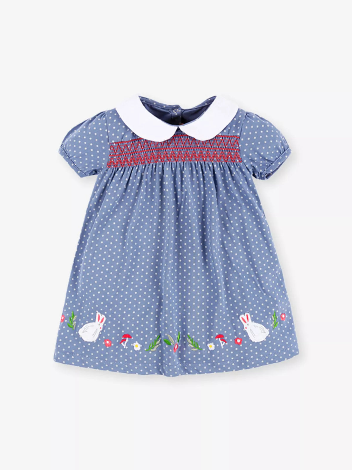 Dusty blue polka-dot dress with embroidery and a white collar laid flat