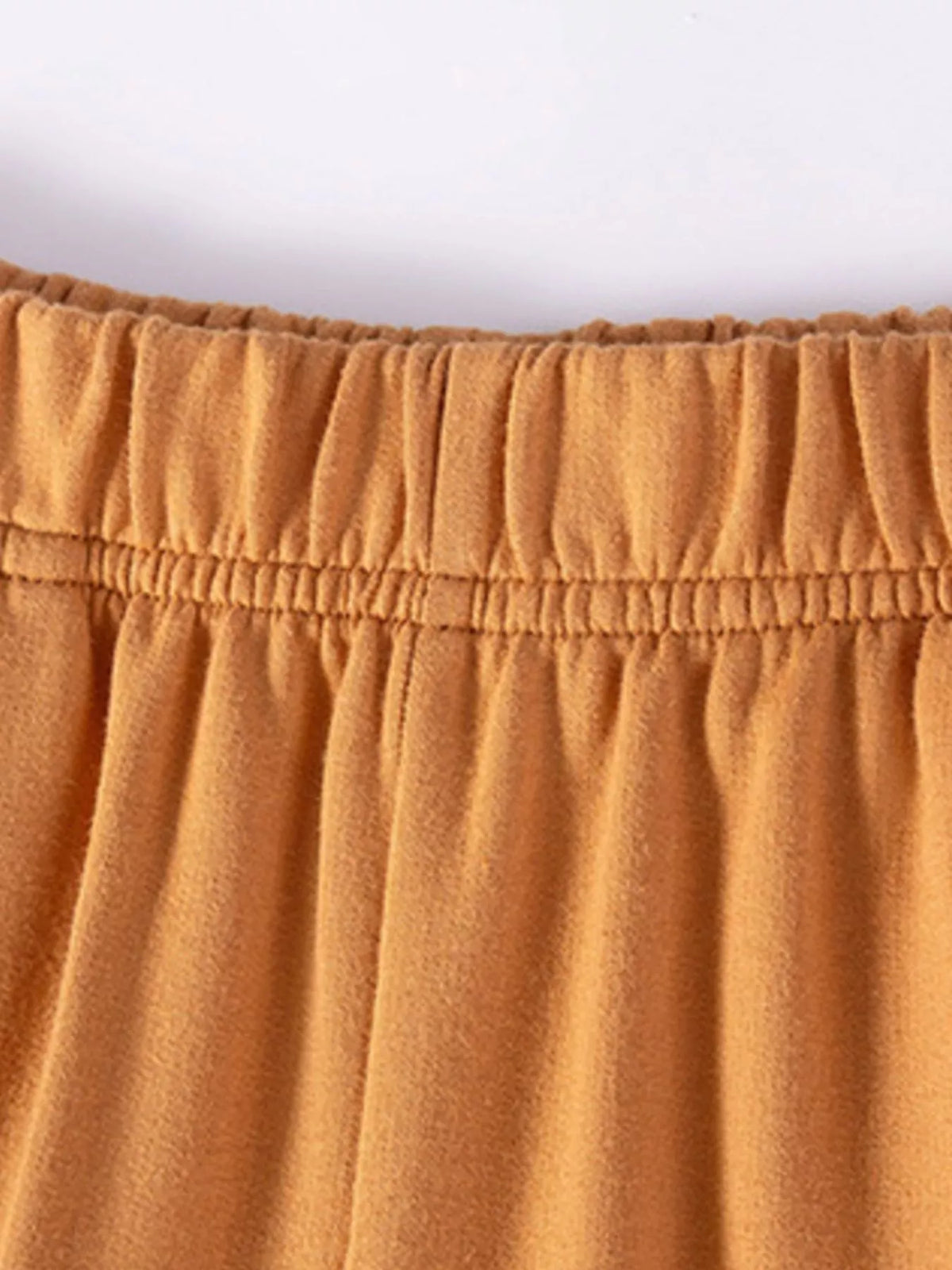 Elastic waistband on caramel pants