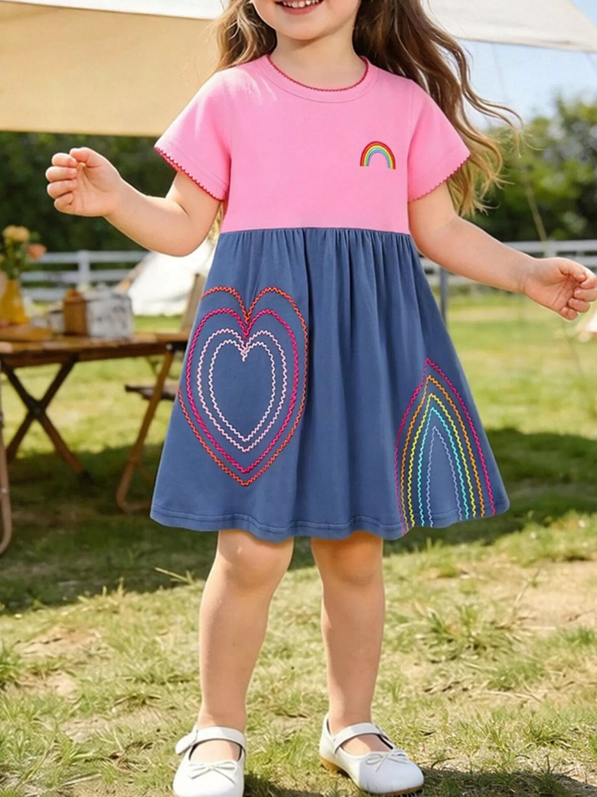 Pink and Blue Heart Embroidered Dress — dress worn by a child