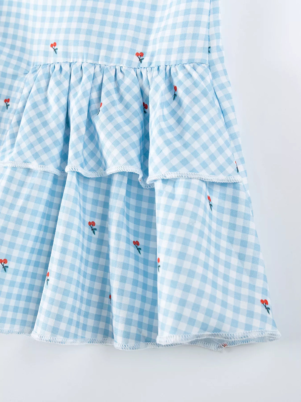 Blue Gingham Asymmetric Ruffle Dress — asymmetric tiered ruffles