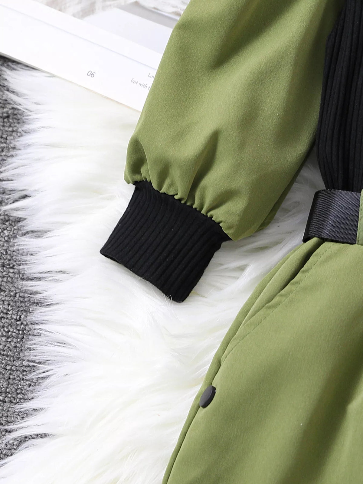 Green puff sleeve with black ribbed cuff