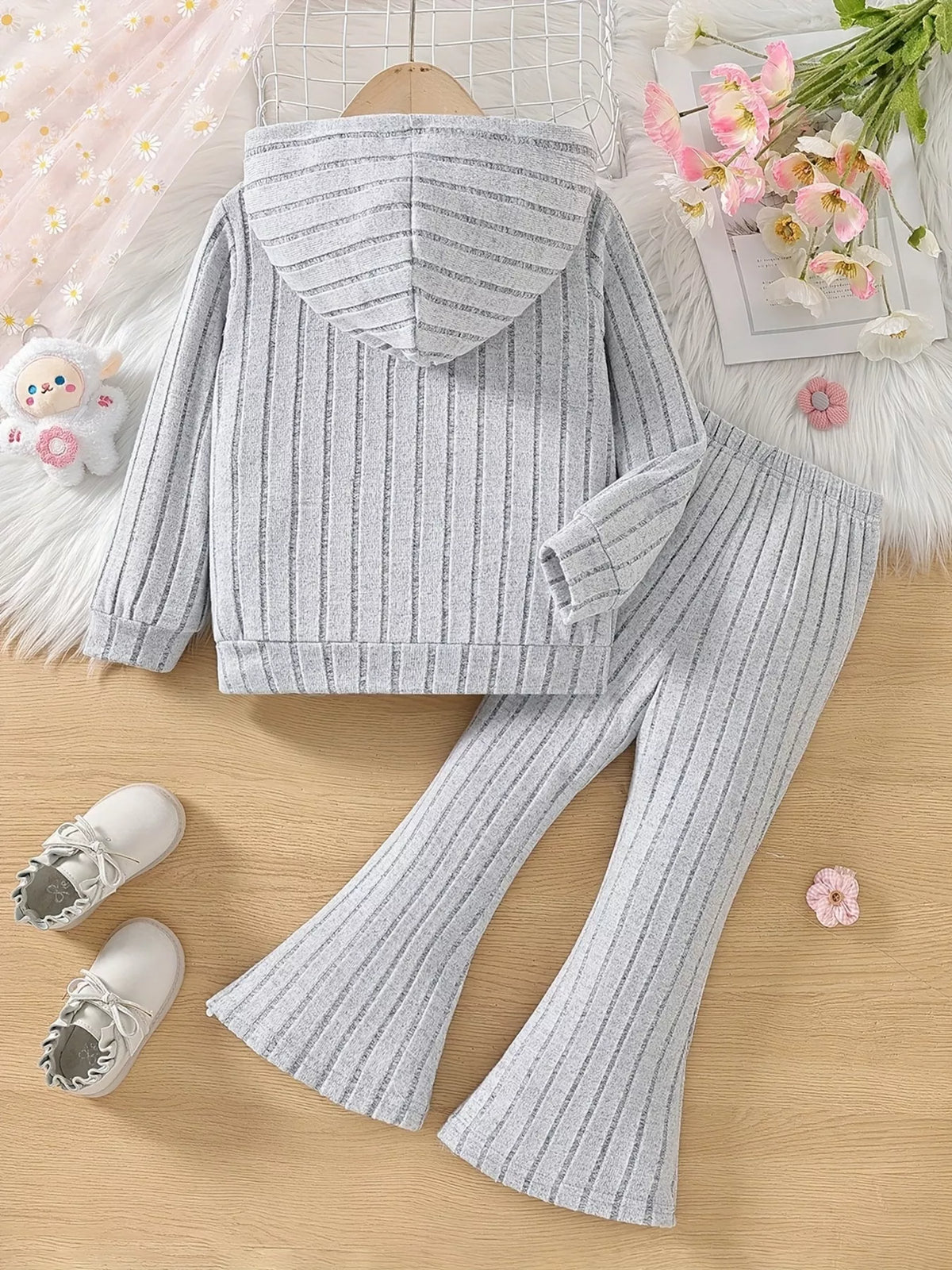 Back of the gray hoodie and flared pants