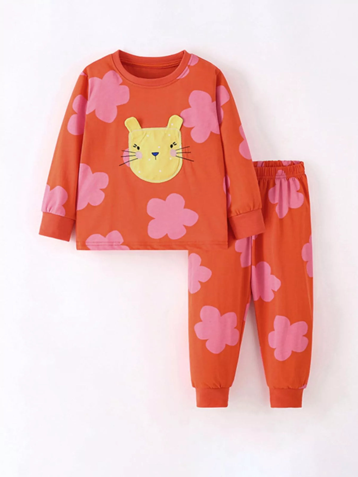 Orange-red flower-print top with a yellow cat applique and matching pants laid flat