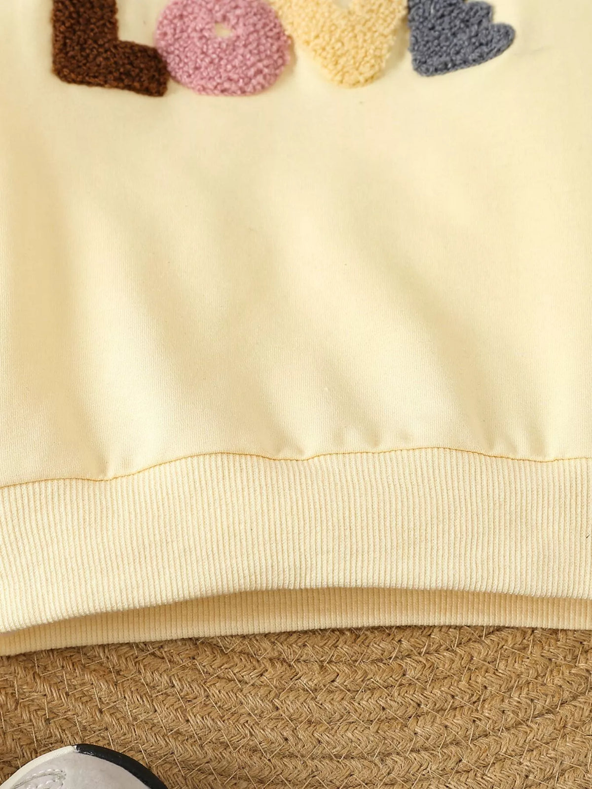 Pale yellow ribbed top hem