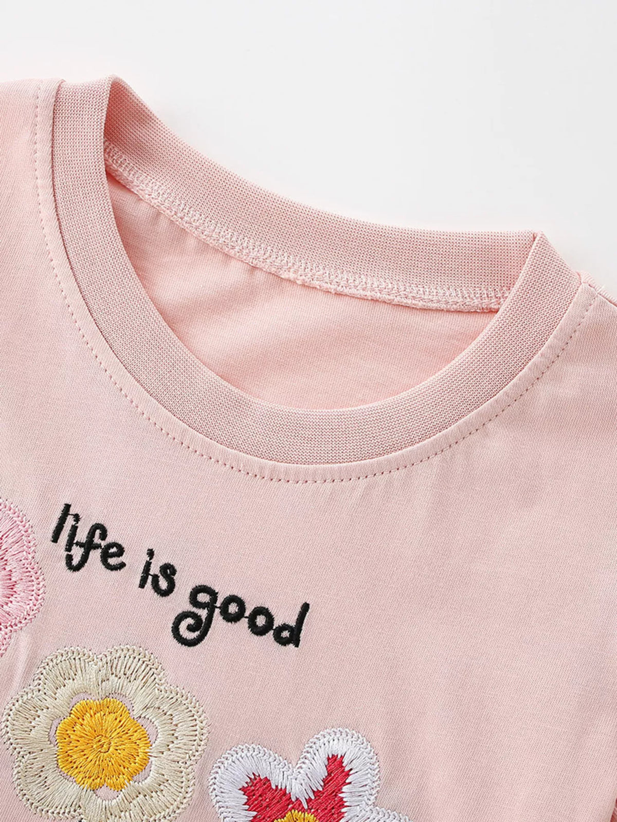 Pink embroidered flower ruffle sleeve shirt — round neckline