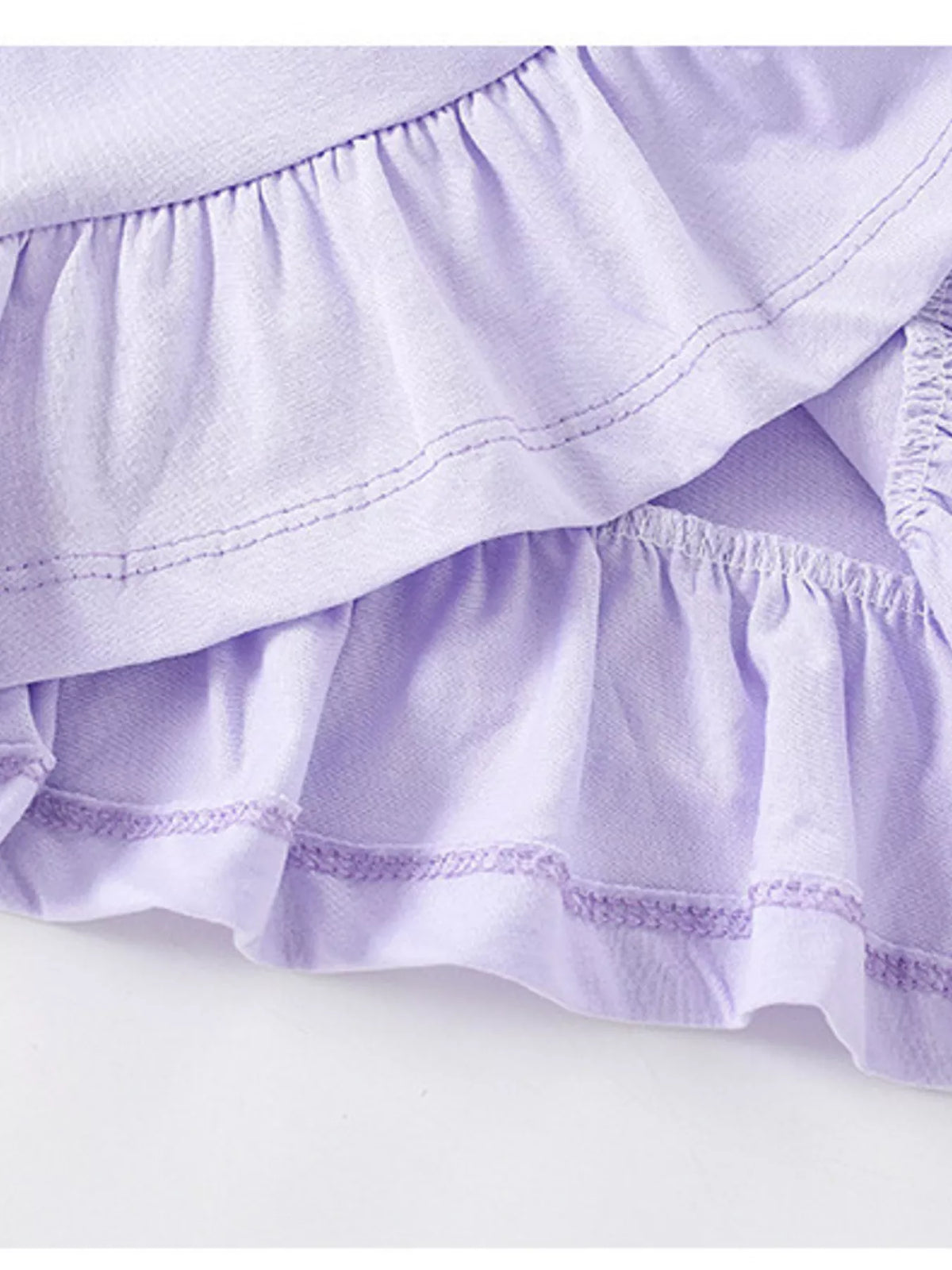 Lavender cat graphic pompom ruffle hem shirt — ruffle hem